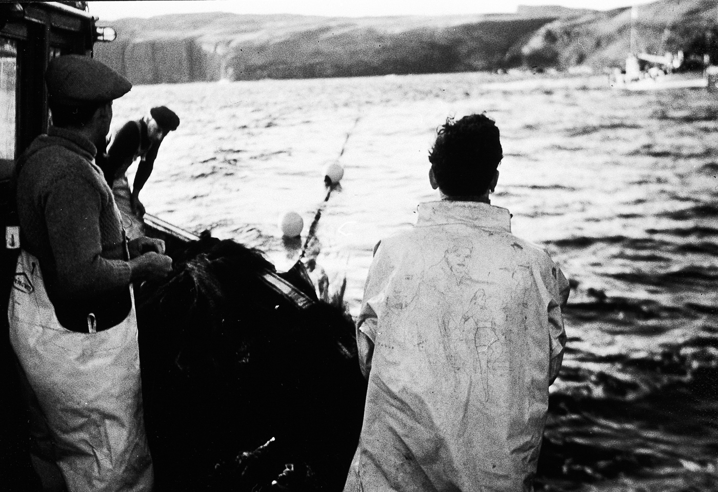 Fisherman shooting a ringnet, possibly onboard 'Margaret Ann II', OB198.