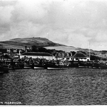 Postcard entitled 'Campbeltown Harbour', Campbeltown, showing boats in the harbour.