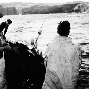 Fisherman shooting a ringnet, possibly onboard 'Margaret Ann II', OB198.