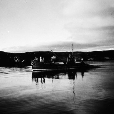 Fisherman shooting a ringnet, possibly onboard 'Margaret Ann II', OB198.