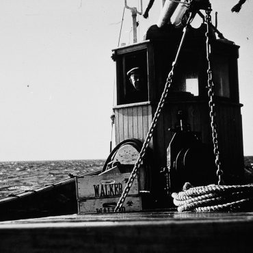 Skipper in wheelhouse